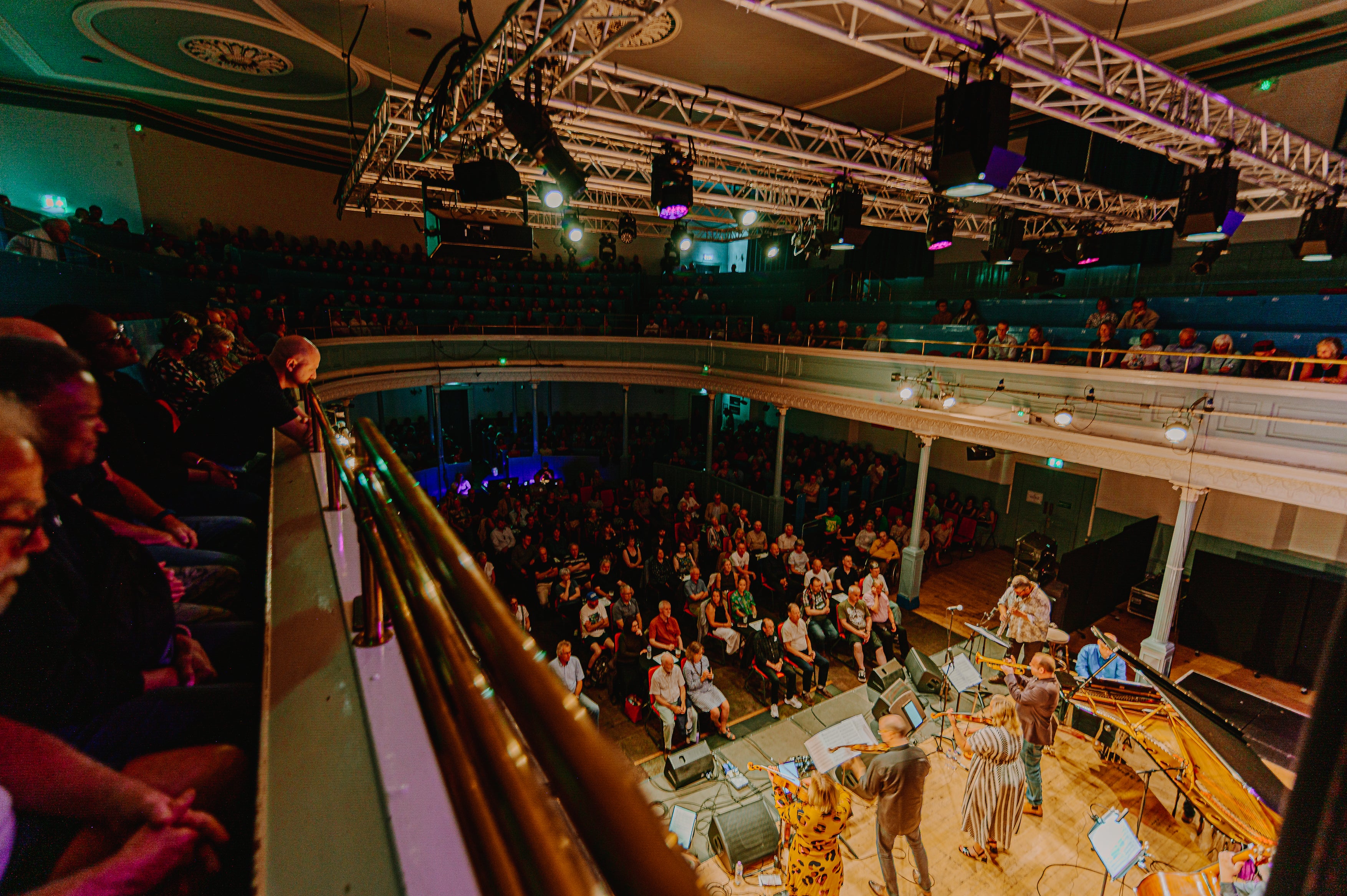 Live performance in a theater with audience and stage
